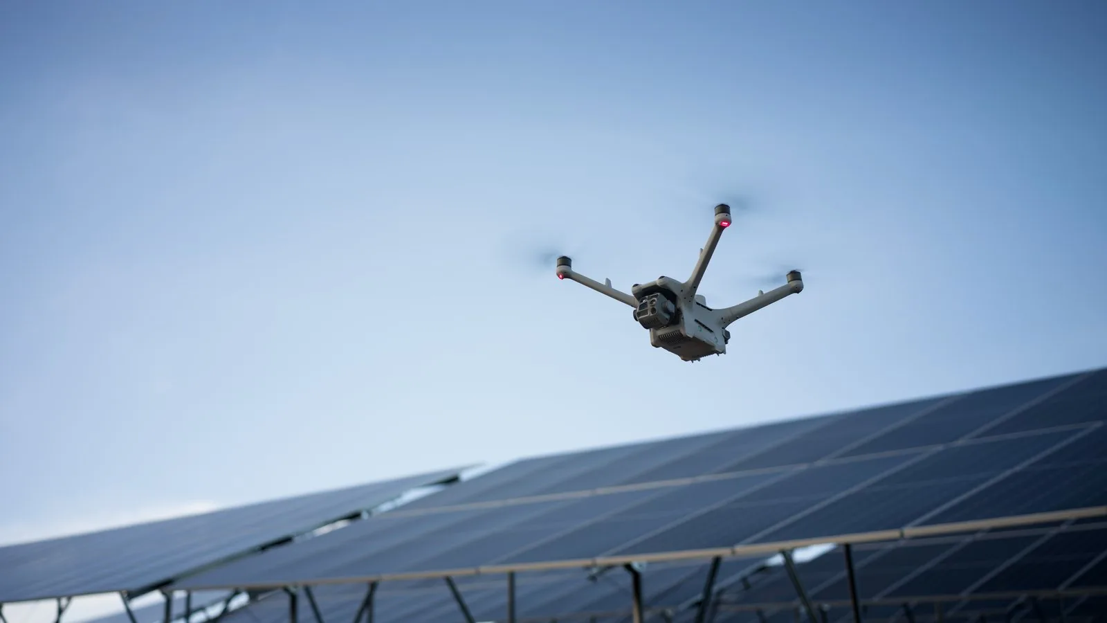 Drone flying over solar modules