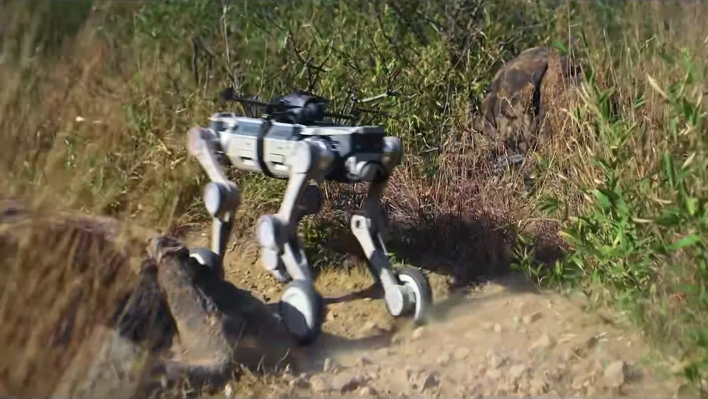 Four-legged robot moving across open terrain