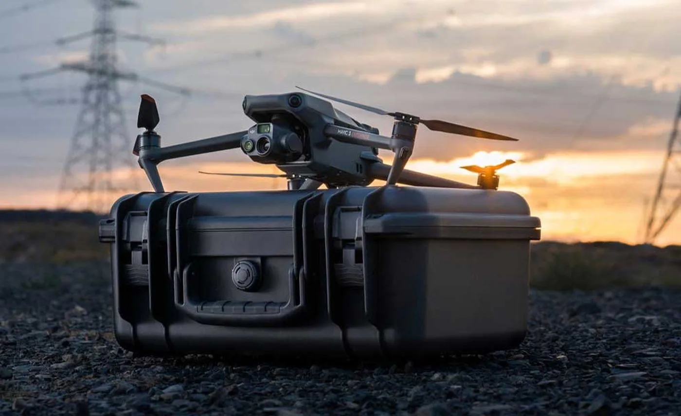 Drone with an open transport case in the field