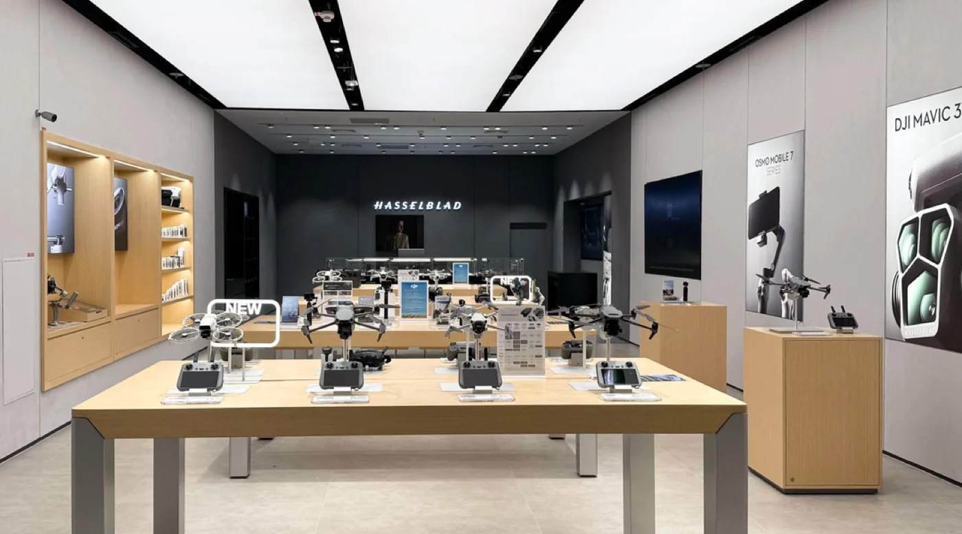 Inside a DJI Store, with drones and cameras on display tables
