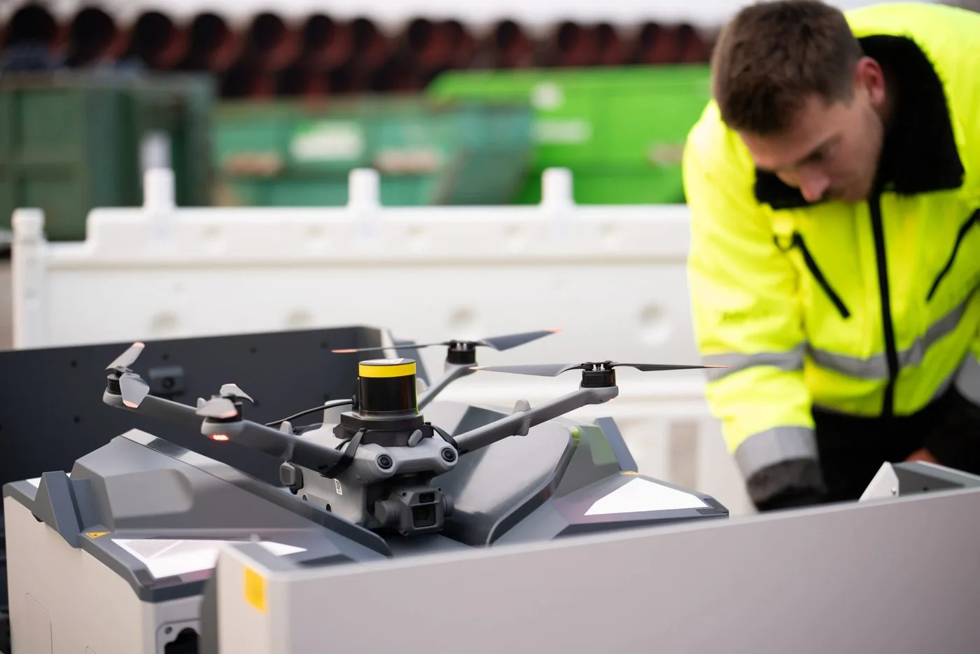 Technician preparing an industrial drone at its transport case