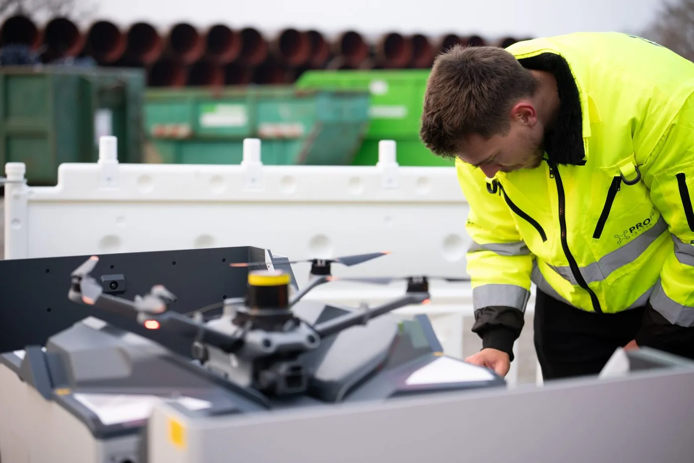 Technician preparing an industrial drone at its transport case