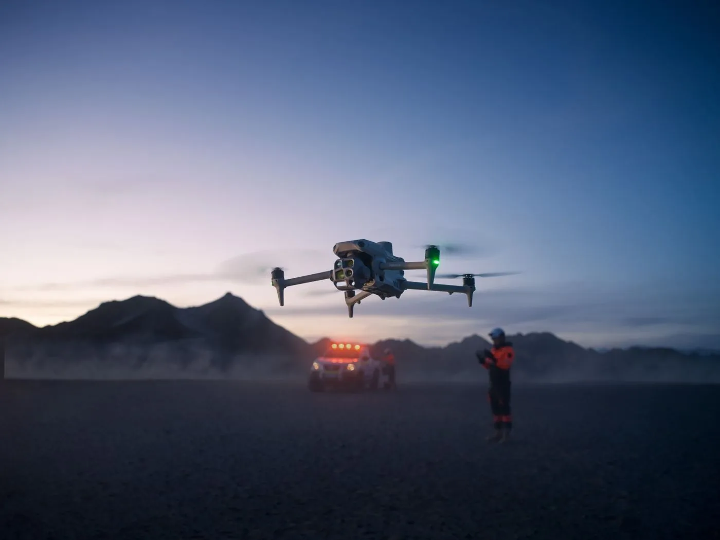 Operations team with an industrial drone at dusk