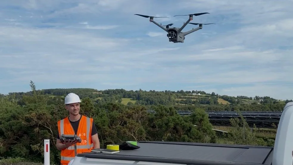 Solectric pilot at a pick-up truck flying an industrial drone over the Ilos solar farm