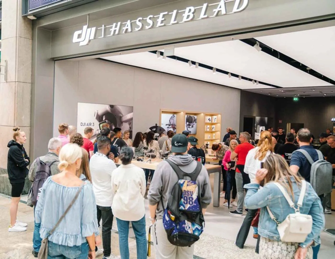 Crowds at the opening of a DJI and Hasselblad store